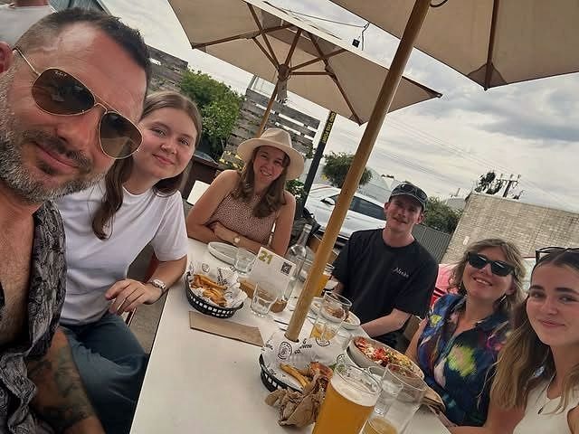 Friends sharing coffee at an outdoor table